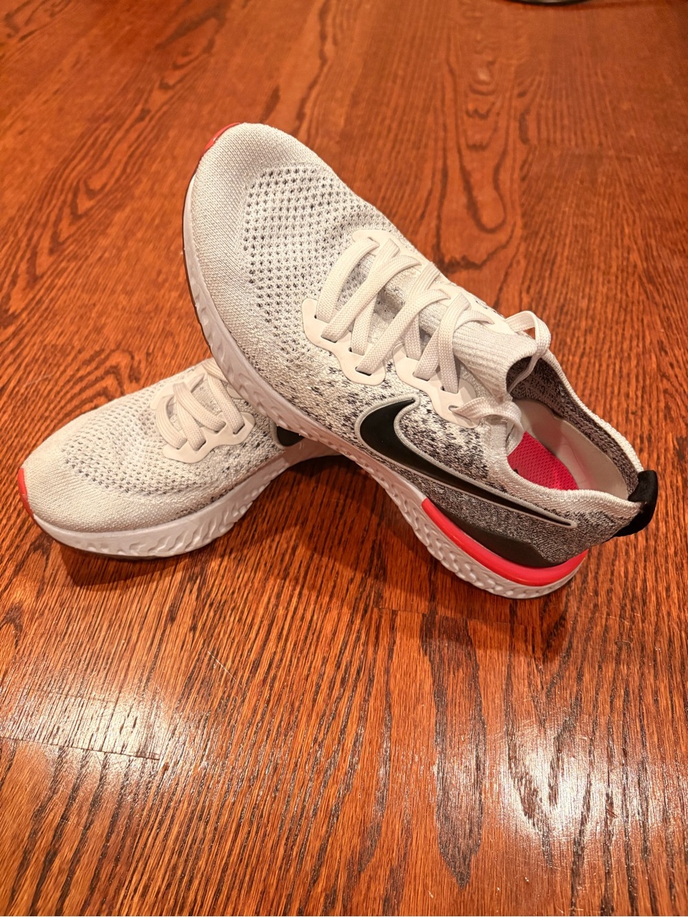 Nike Women’s White Running Shoes with Black Swoosh and Pink Accents